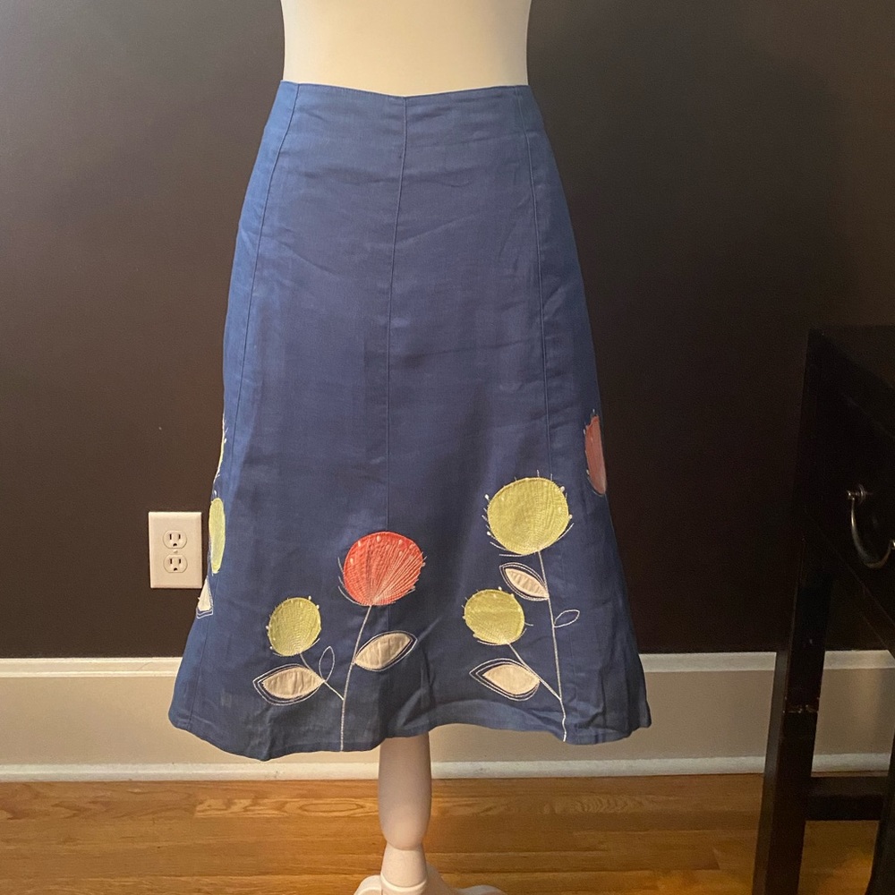 Boden size 8 skirt with embroidered flowers across bottom.